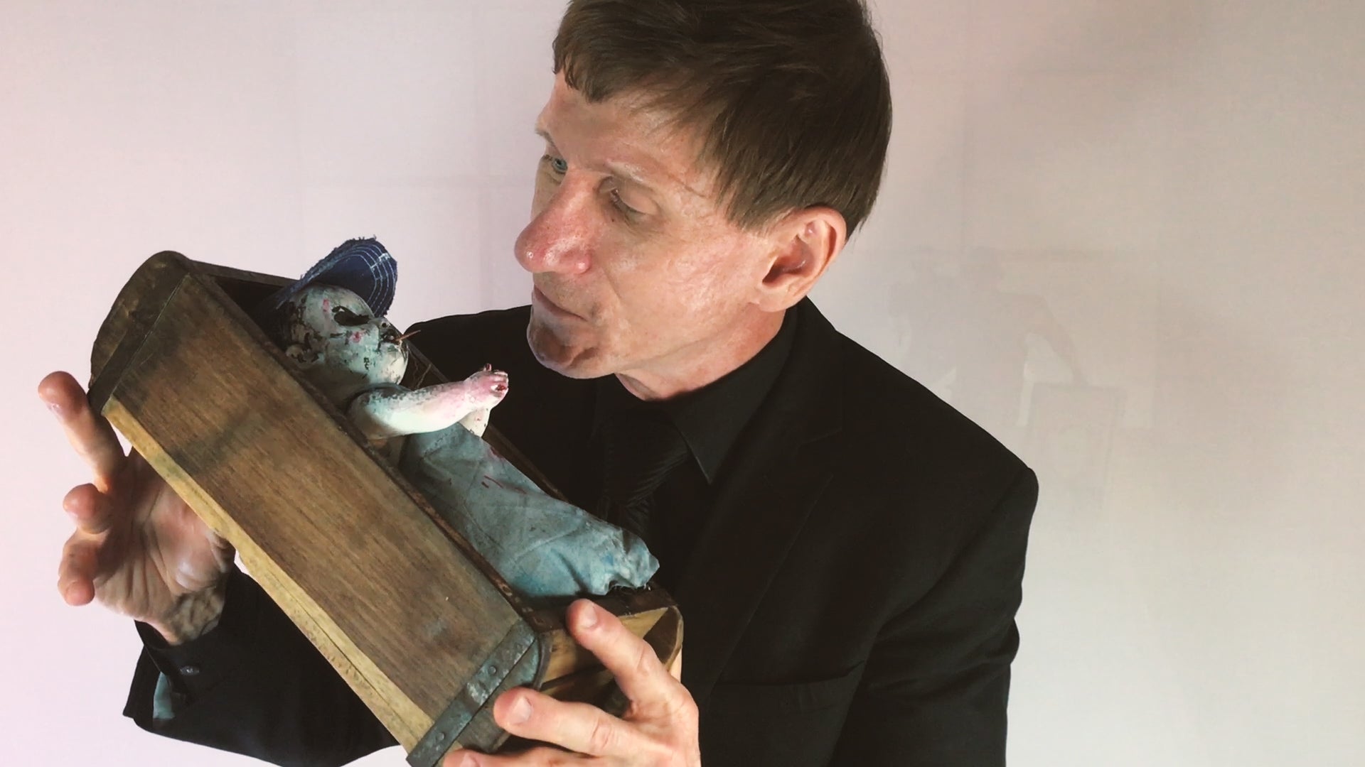 Load video: Bill Oberst Jr. talks about the Small Backwoods Baby product in his Bill Oberst Jr. Limited Editions line of curated collectible horror gifts.